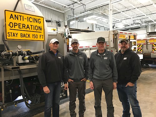Public works staff near a brine truck